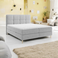 Lit BOXSPRING LEO - Avec tête de lit, coffre intégré, matelas ressorts ensachés et surmatelas inclus